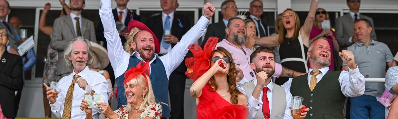 Some of the grandstand at Southwell celebrating a win at the races