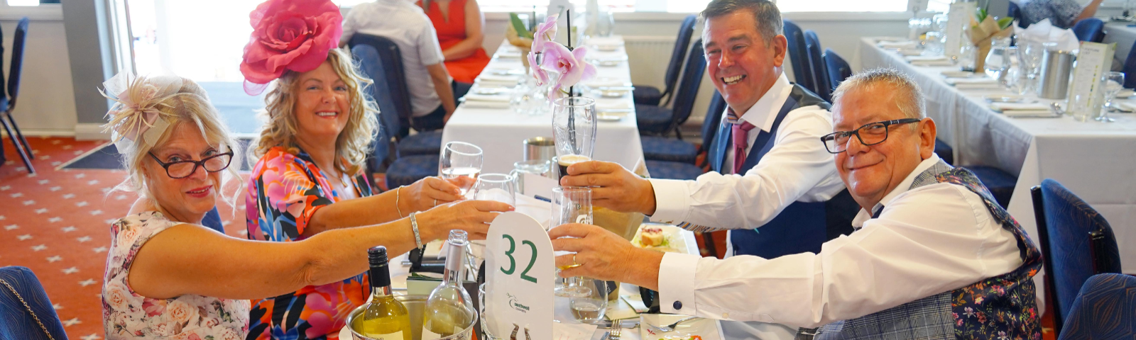 Group of people cheering with prosecco