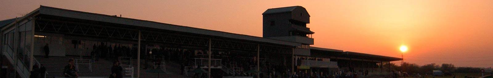 Sunset over the Grandstand at Southwell Racecourse.