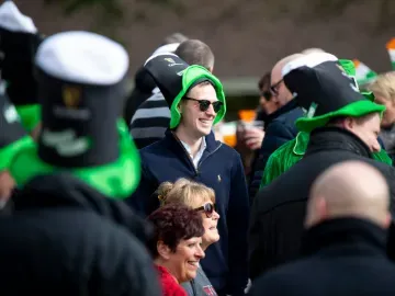 Group of people at St Patricks Racenight at Southwell Racecourse smiling and laughing